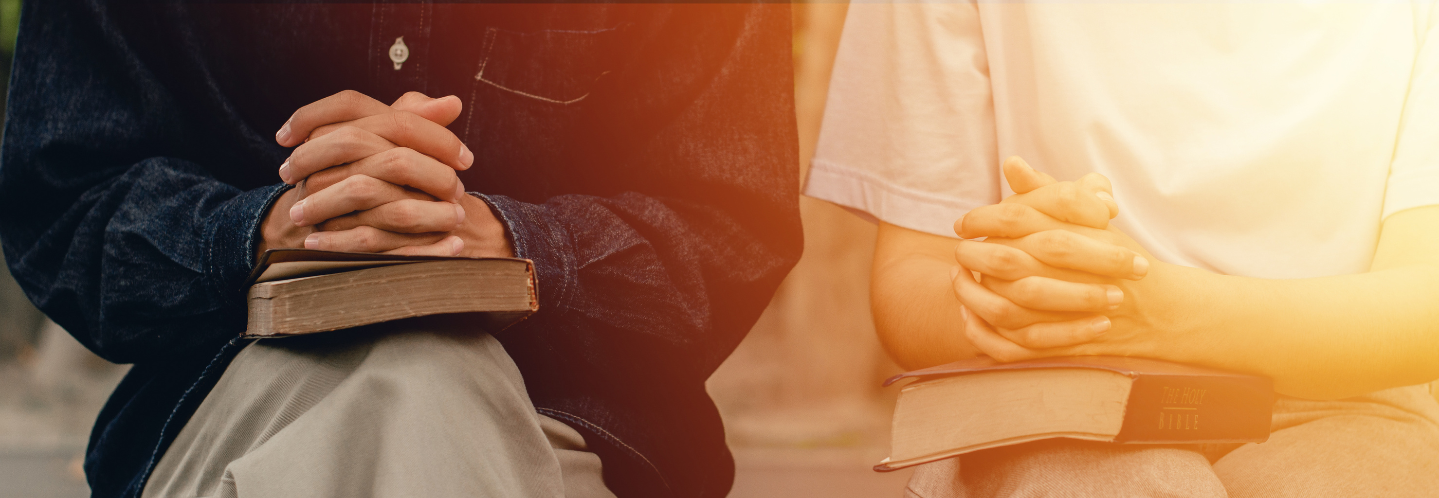 young couples praying to god together and study the Bible together to serve God